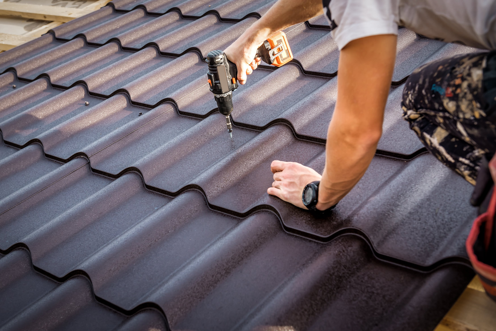 Assure-U Roofing crew installing a standing seam metal replacement roof in Orlando, FL