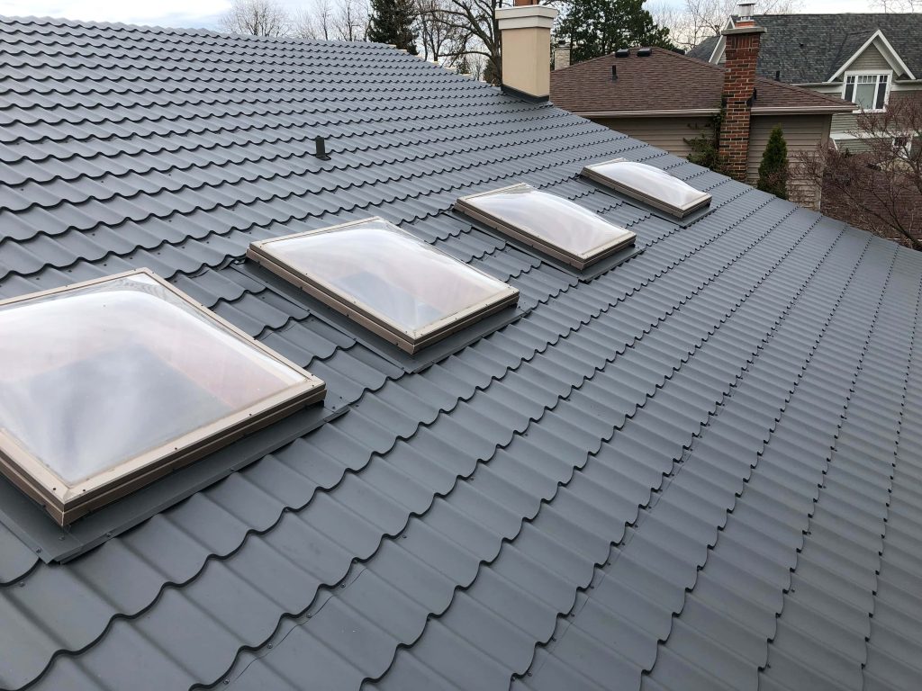 Metal tile roof with skylights completed on a Central Florida home