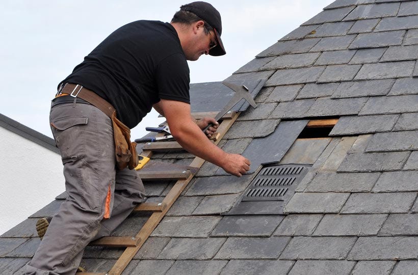 Roofer replacing a roof vent during a leak repair in Central Florida