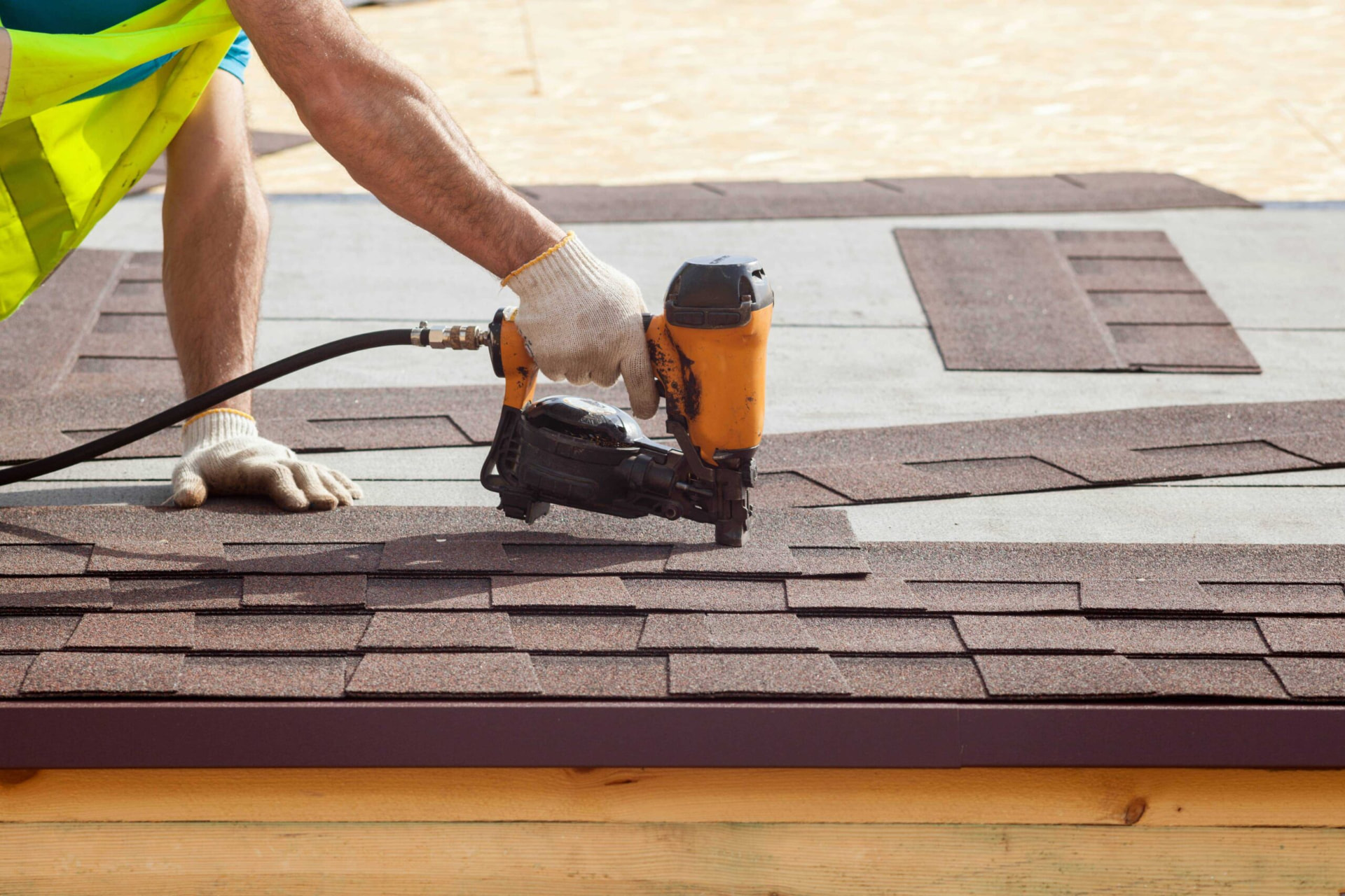 Architectural shingle roof replacement being nailed down in Orlando, FL